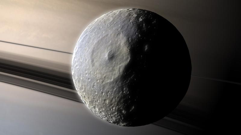 Luna Mimas orbitand in jurul lui Saturn (reprezentare artistica)