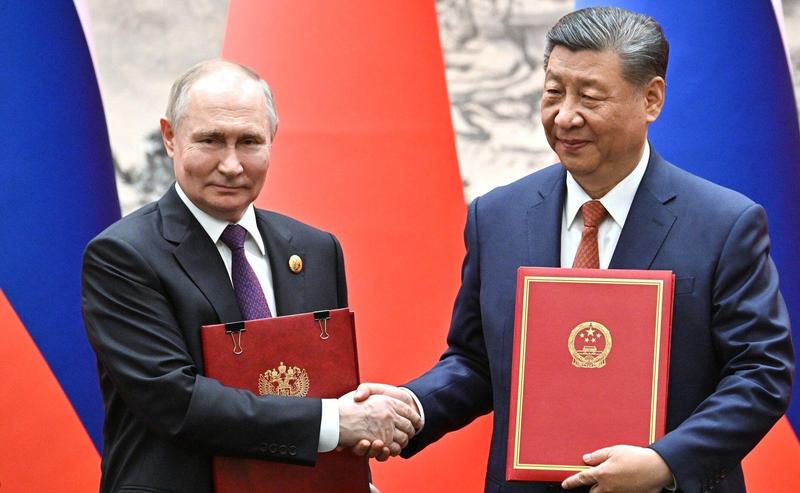 Președintele rus Vladimir Putin și omologul său chinez Xi Jinping